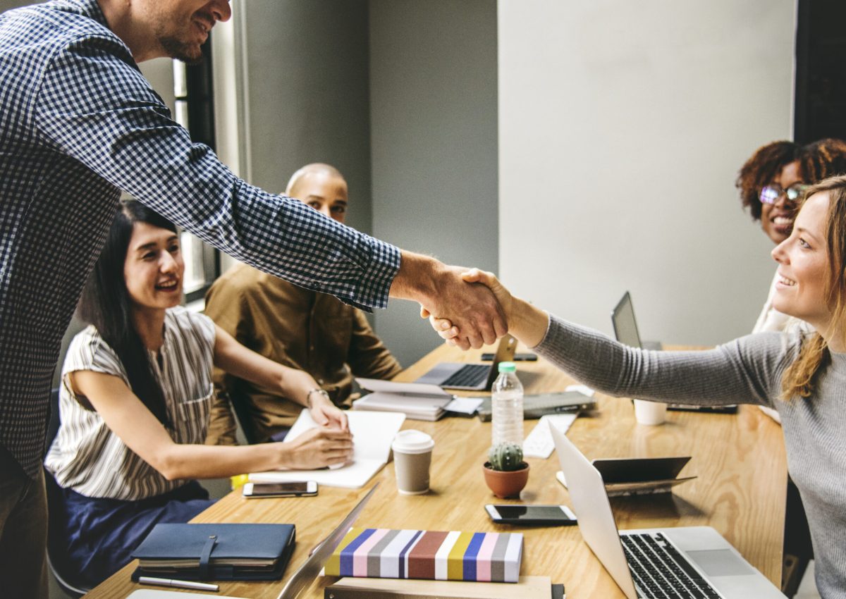 Business people shaking hands in agreement